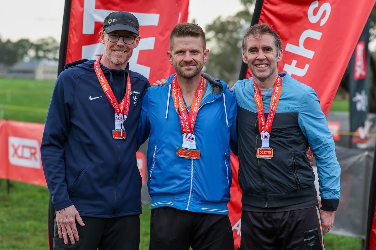 John McGuinness on the podium with his bronze medal at the Victorian Cross Country Championships, Bundoora