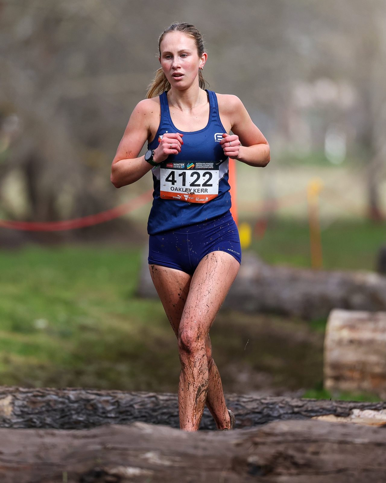 Meg Oakley Kerr running in Victorian colours at the national cross country championships