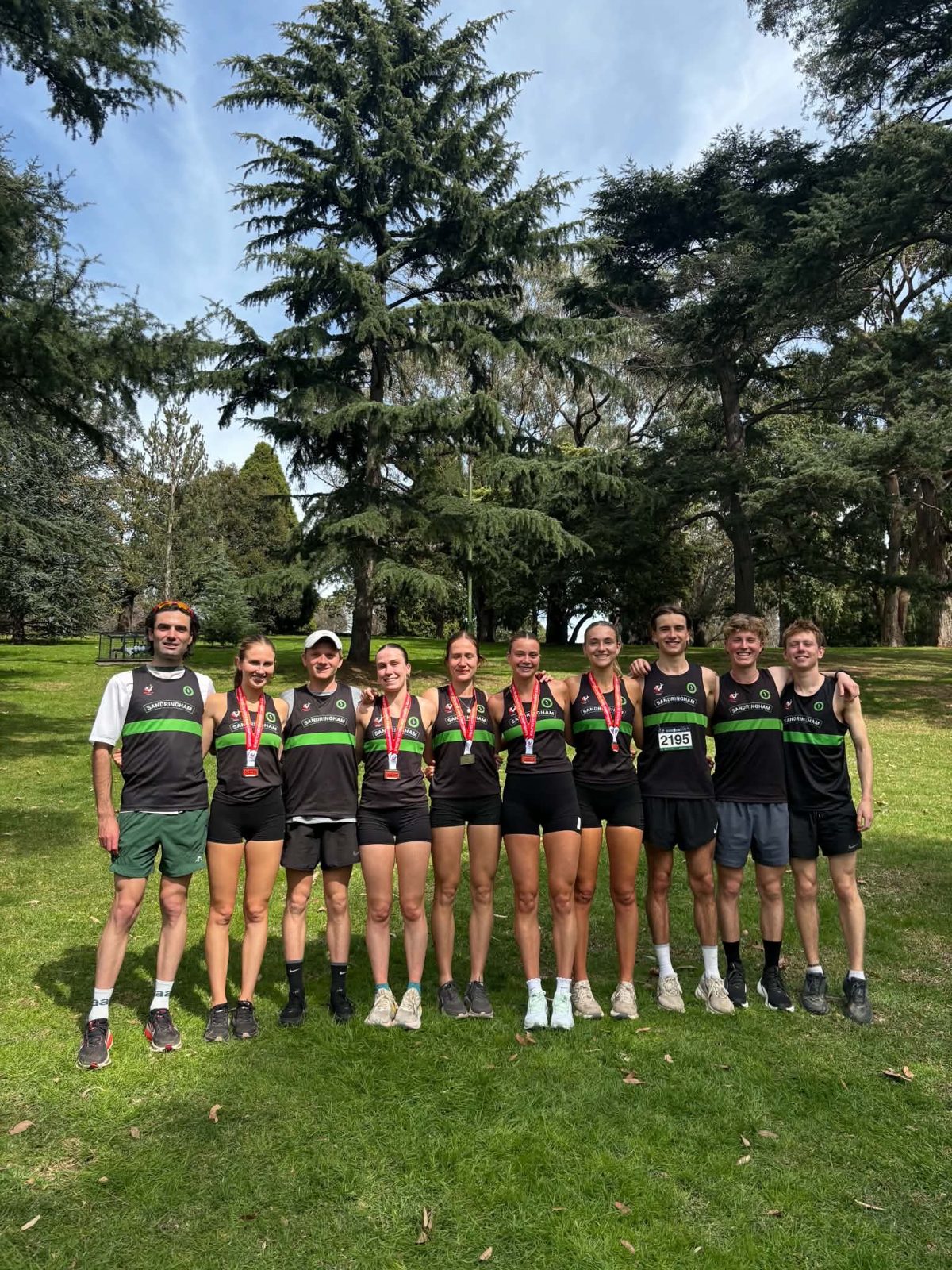 Sandringham athletes gathered in the parkland at the Tan after racing