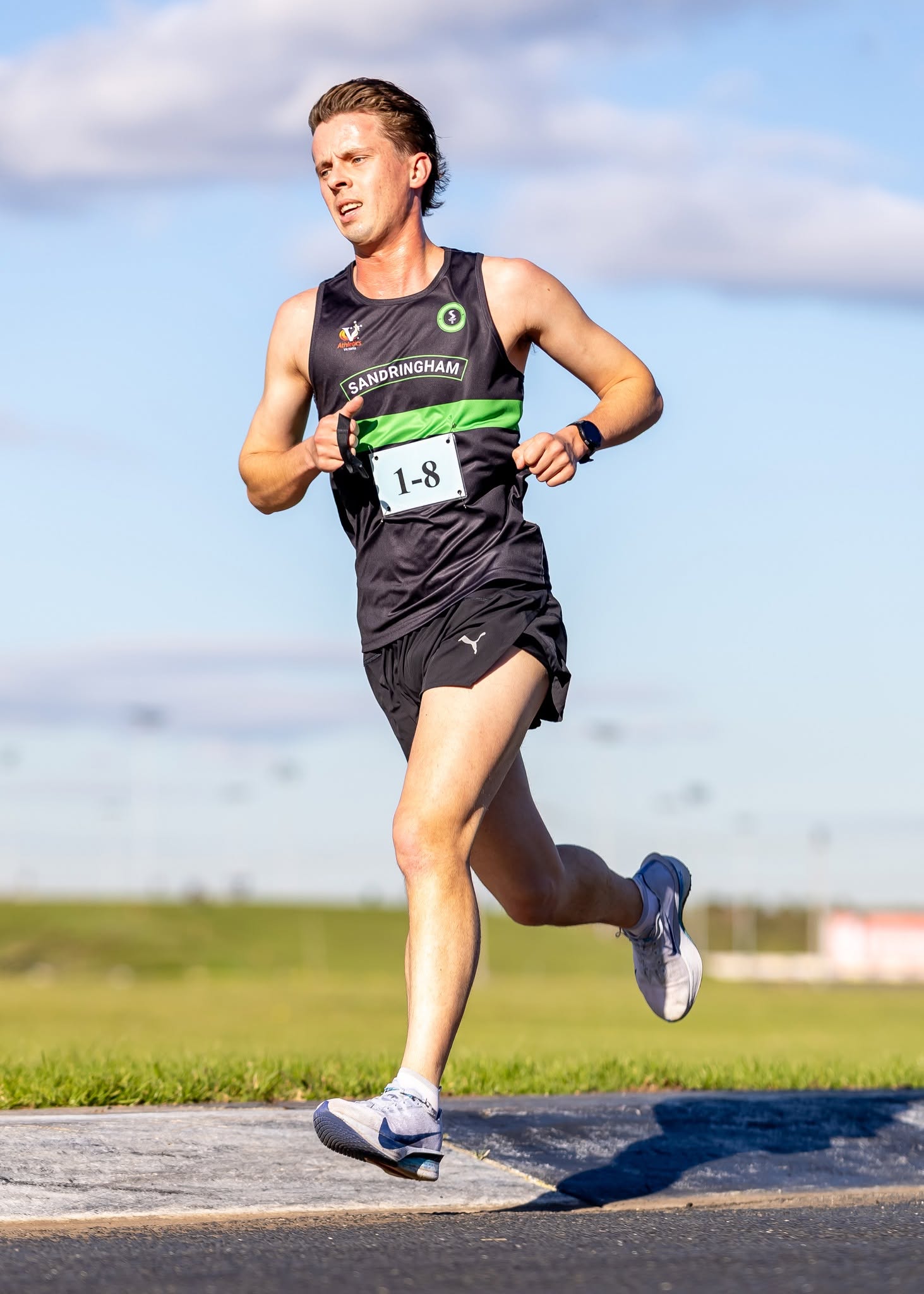 Sandy runner driving through his relay leg at Calder Raceway