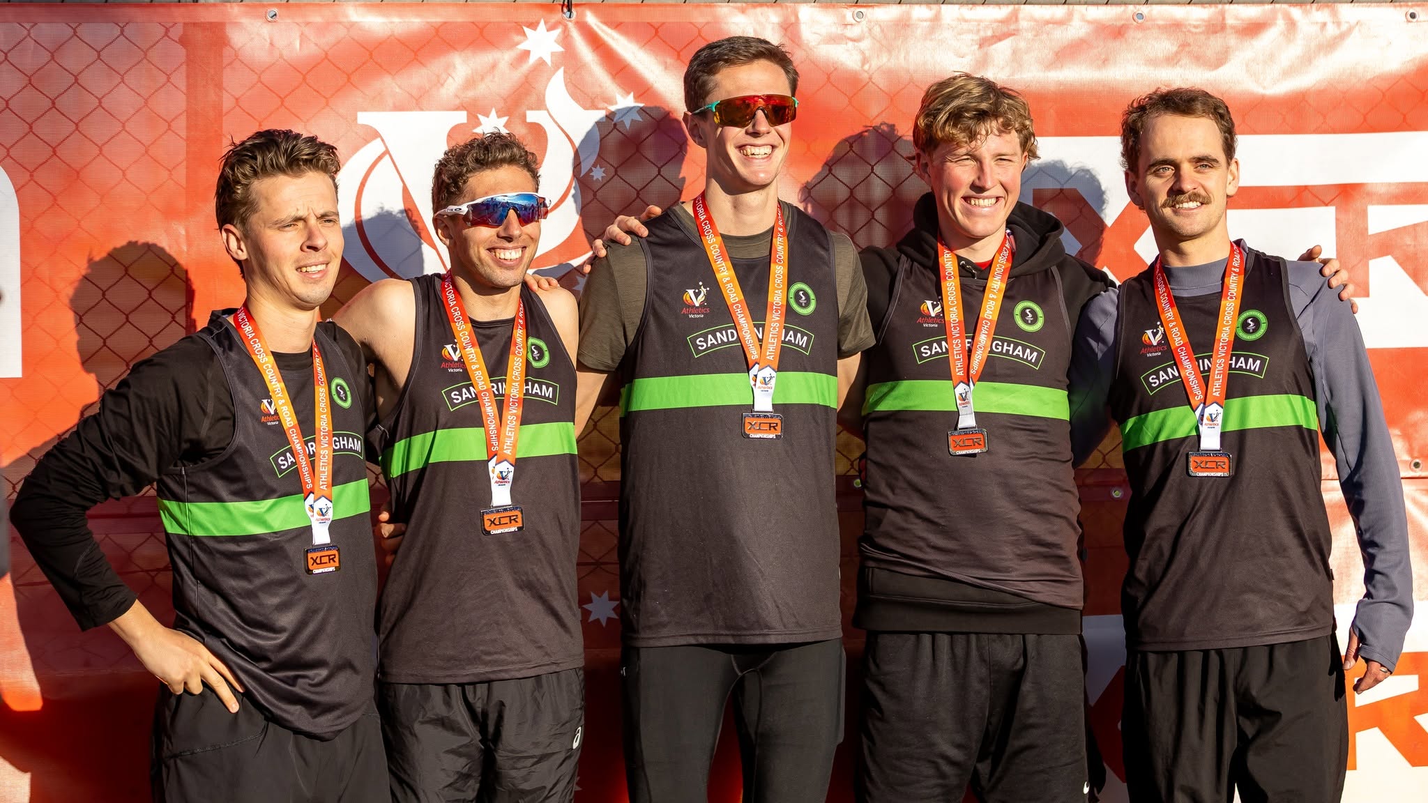 The Sandy Male Open relay team with their medals at Calder Raceway