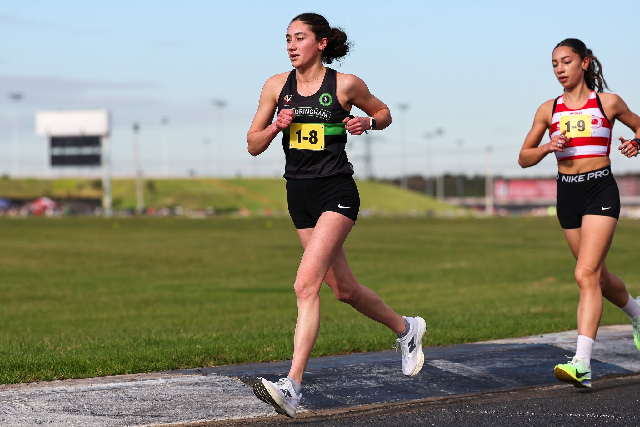 Sandy runner in the women's relay at Calder Raceway