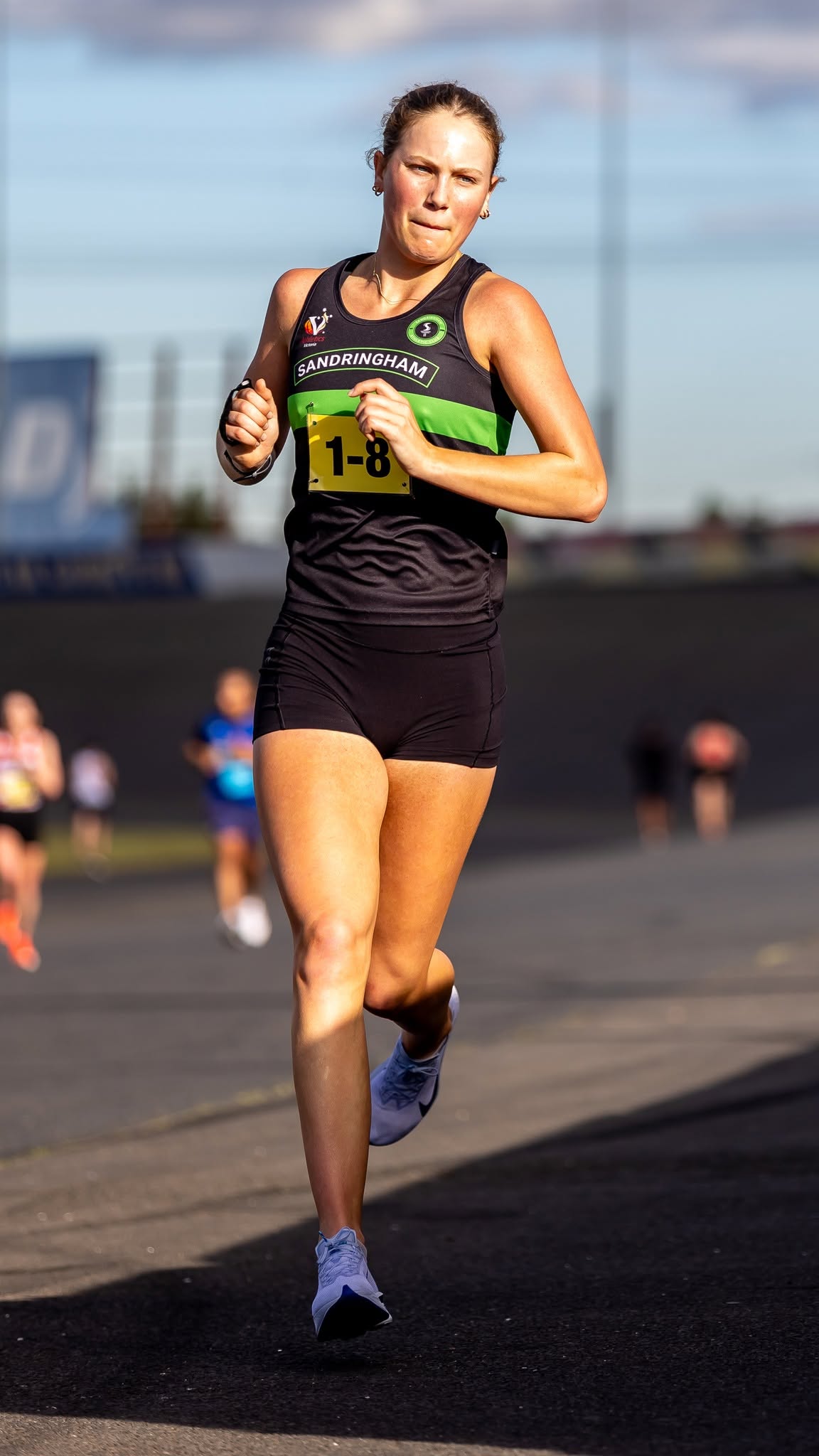 Sandy runner in the women's relay at Calder Raceway