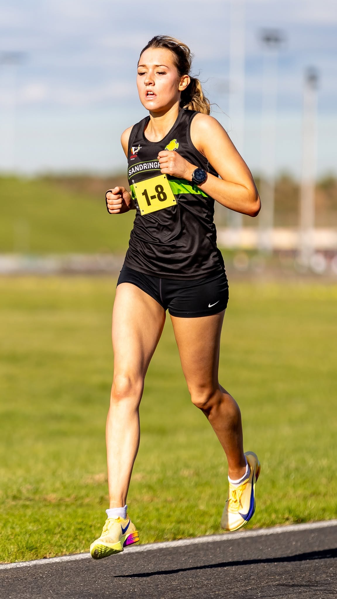 Sandy runner in the women's relay at Calder Raceway
