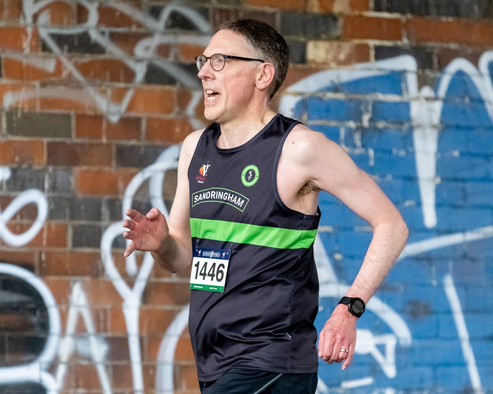 A Sandringham masters runner on the path beside the Yarra at Burnley