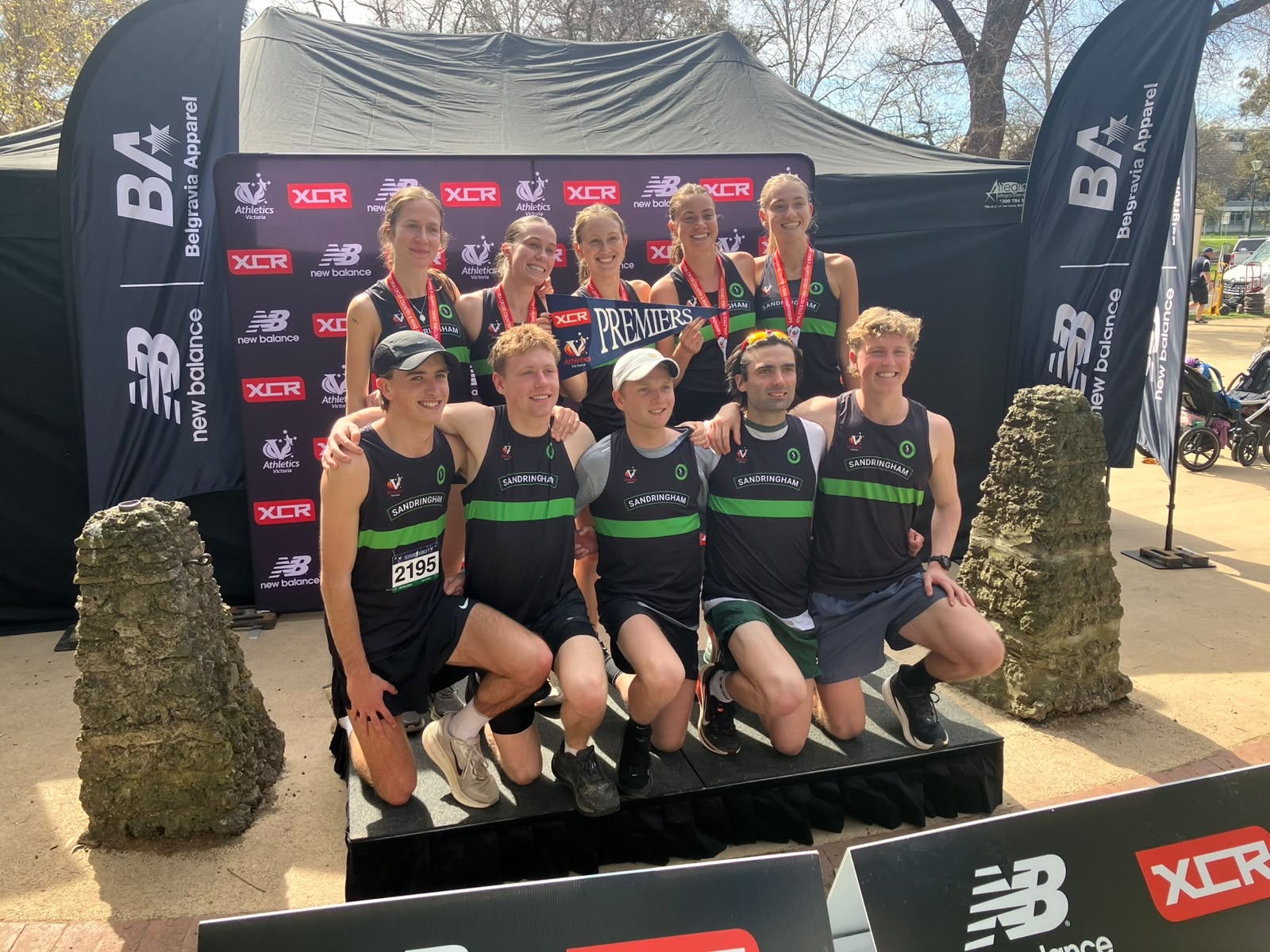 Sandringham’s women and men celebrate their Premier Division double at the Tan Relays